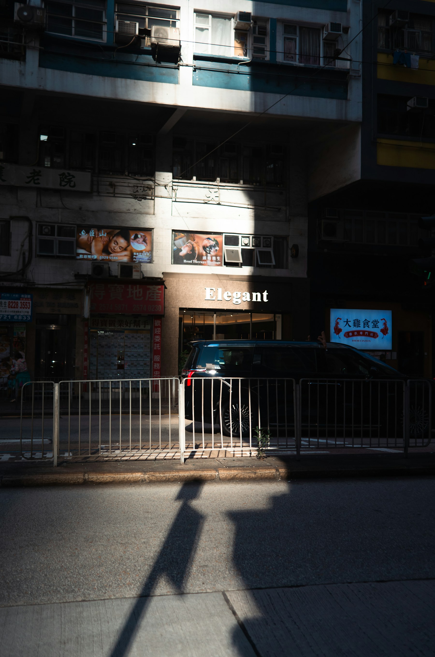 Sunlight and shadow on a city street.